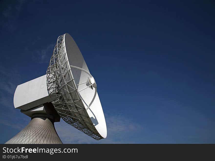 A radio telescope and blue sky, Germany