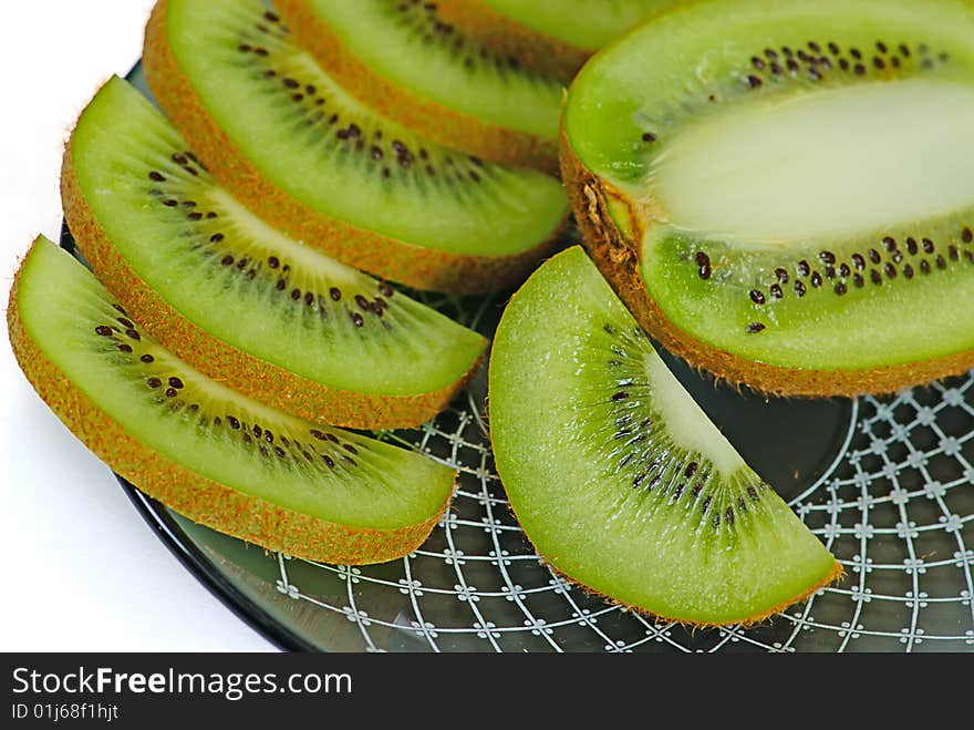 Slice fresh kiwi on a plate