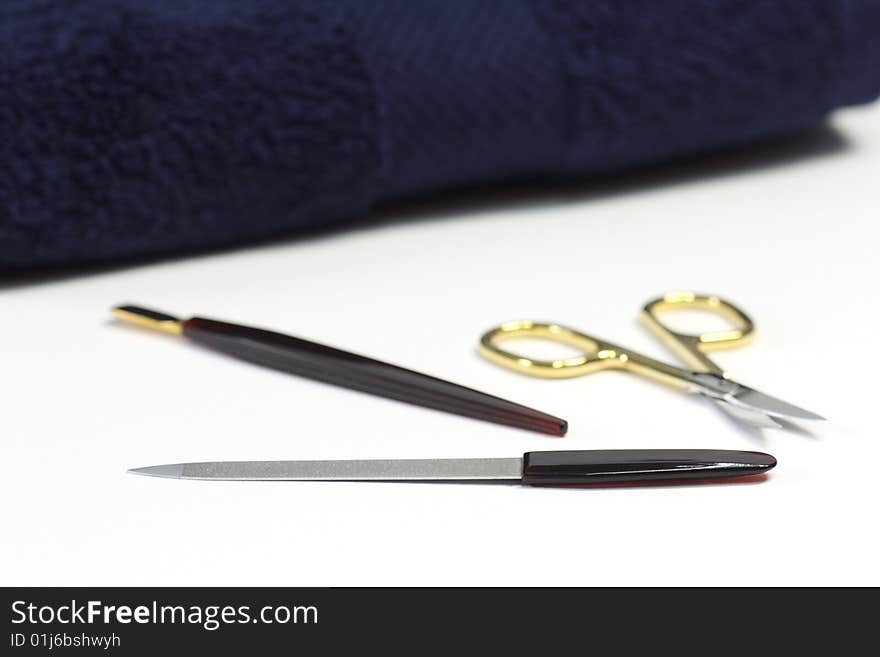 Manicure utensils over white background