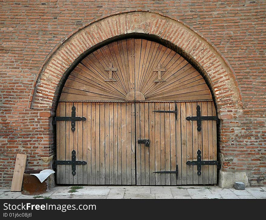 Wooden door with ornamental crosses.