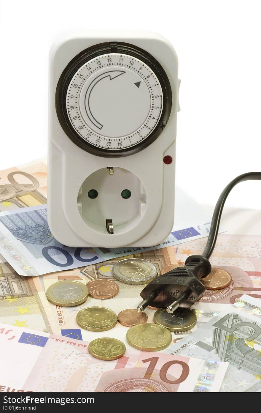 24 hours mechanical timer with Euro coins and bills over white background