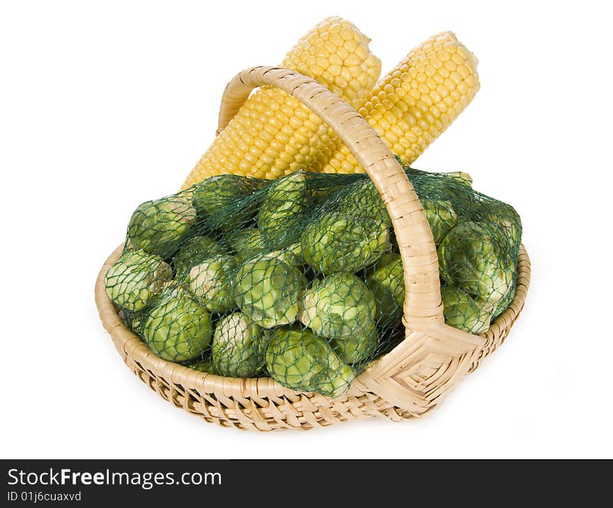 Brussels sprouts and maize-cob in a basket. Brussels sprouts and maize-cob in a basket