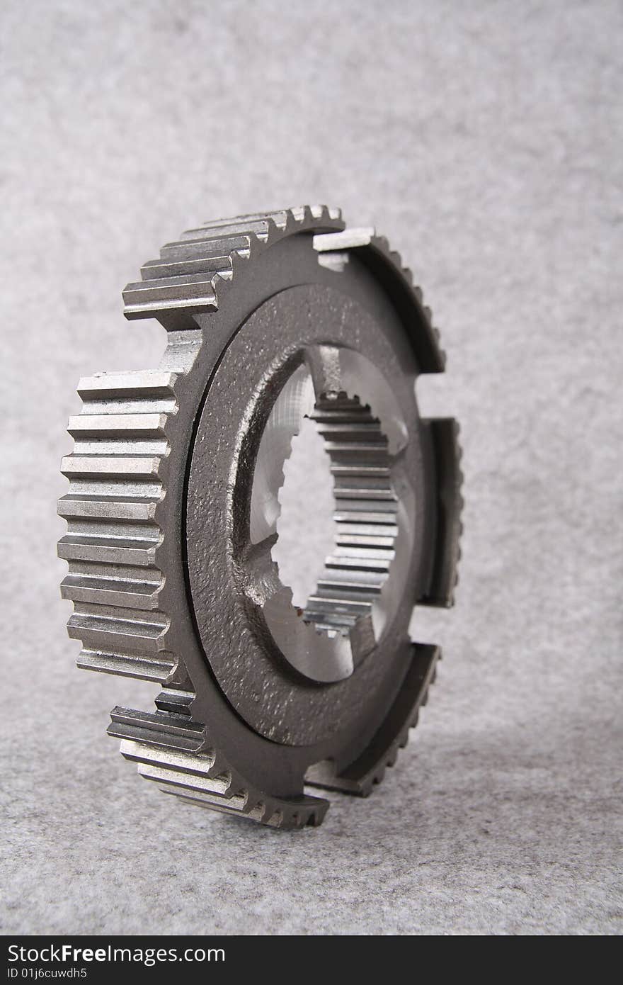 A steel gear isolated on gray background