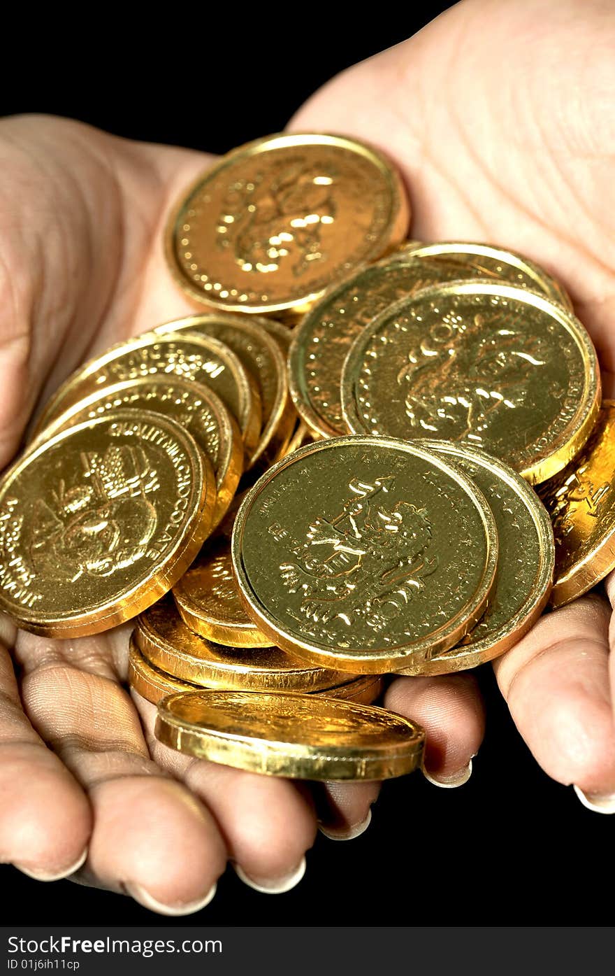 Gold coins on female hands