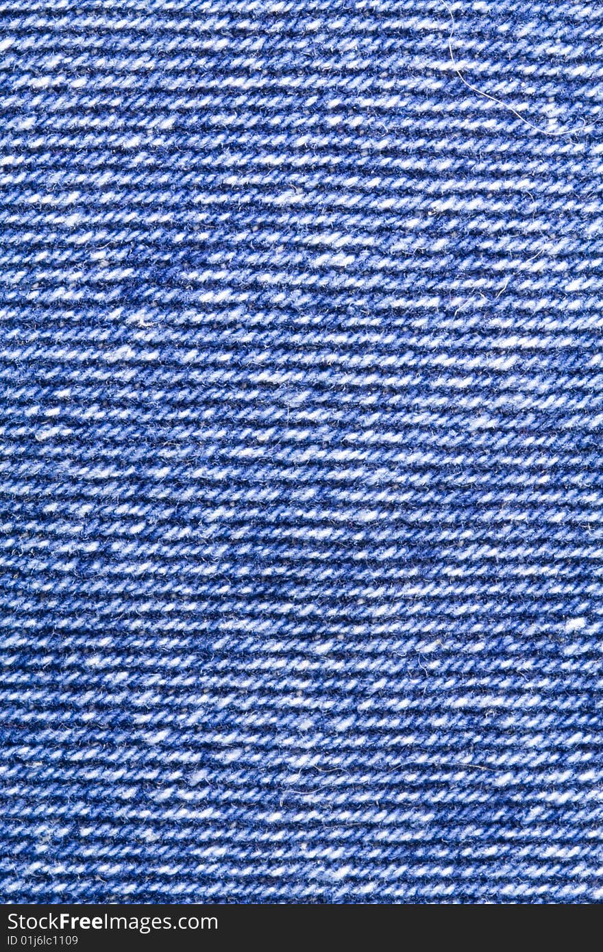 A close-up of the texture of blue jeans fabric. A close-up of the texture of blue jeans fabric