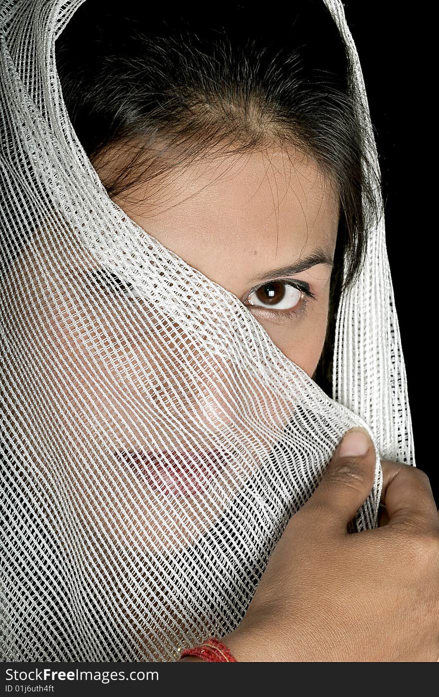 Arabian girl covering her face with white stole