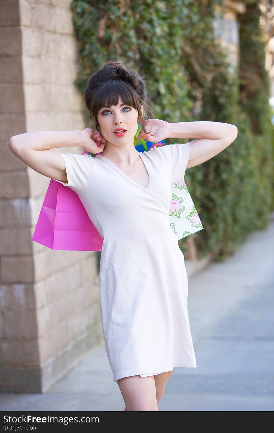 Attractive young woman out on the town shopping