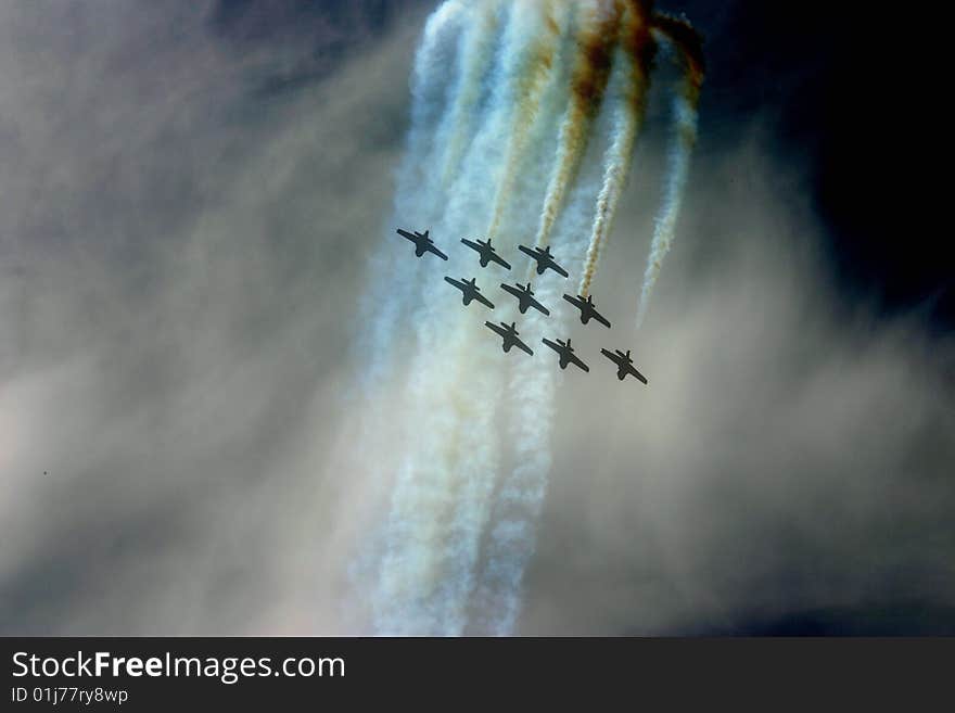 Nine jets in air show performing routine. Nine jets in air show performing routine.