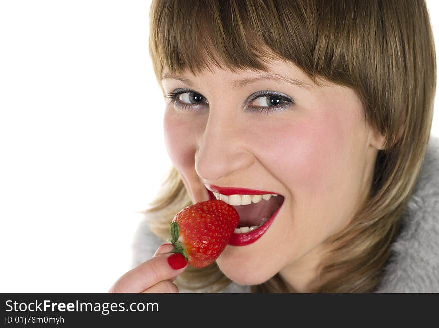 Young beauty woman eating fresh tasty strawberry. Young beauty woman eating fresh tasty strawberry