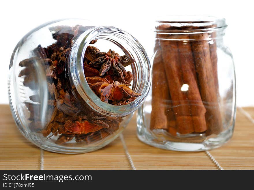 Cinnamon Stick and Anise Star in transparent container. Cinnamon Stick and Anise Star in transparent container