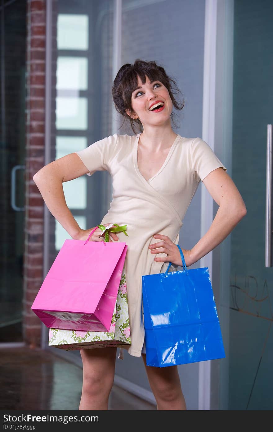 Attractive young woman in a modern shopping mall. Attractive young woman in a modern shopping mall