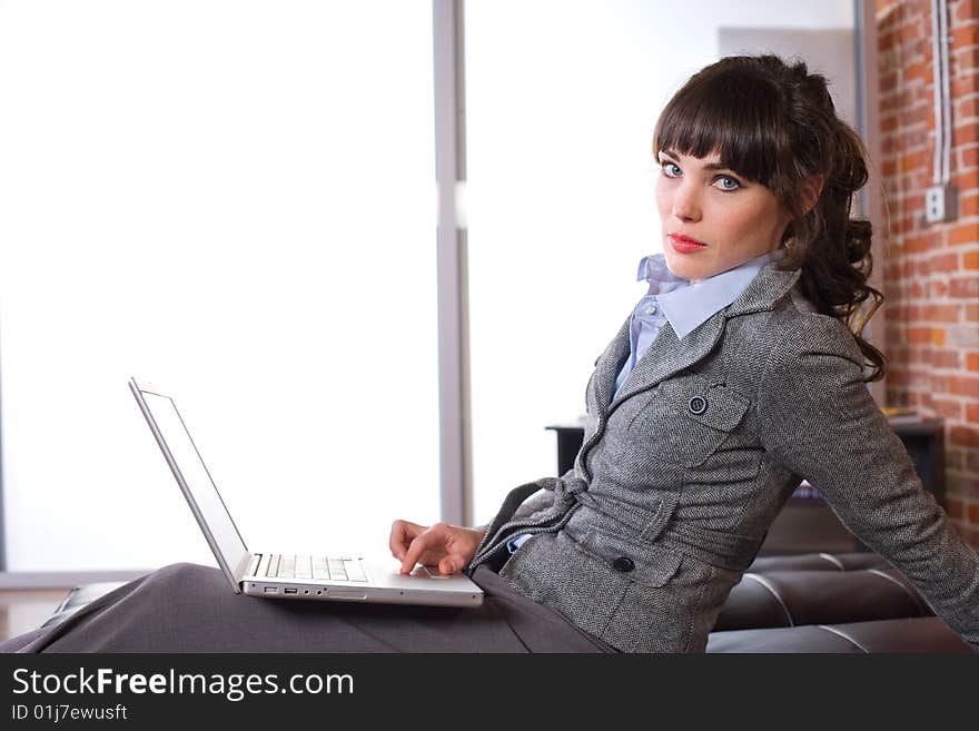 Business woman laptop in modern office. Business woman laptop in modern office