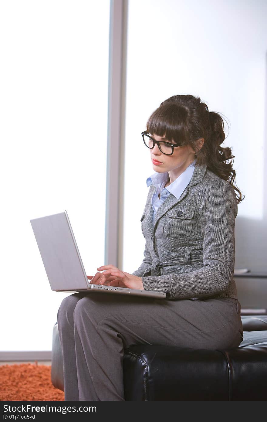 Business woman laptop in modern office. Business woman laptop in modern office