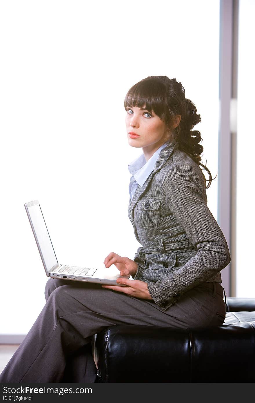 Business woman laptop in modern office. Business woman laptop in modern office