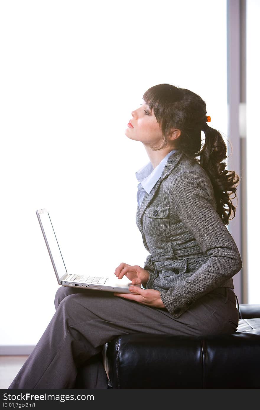 Business woman laptop in modern office. Business woman laptop in modern office