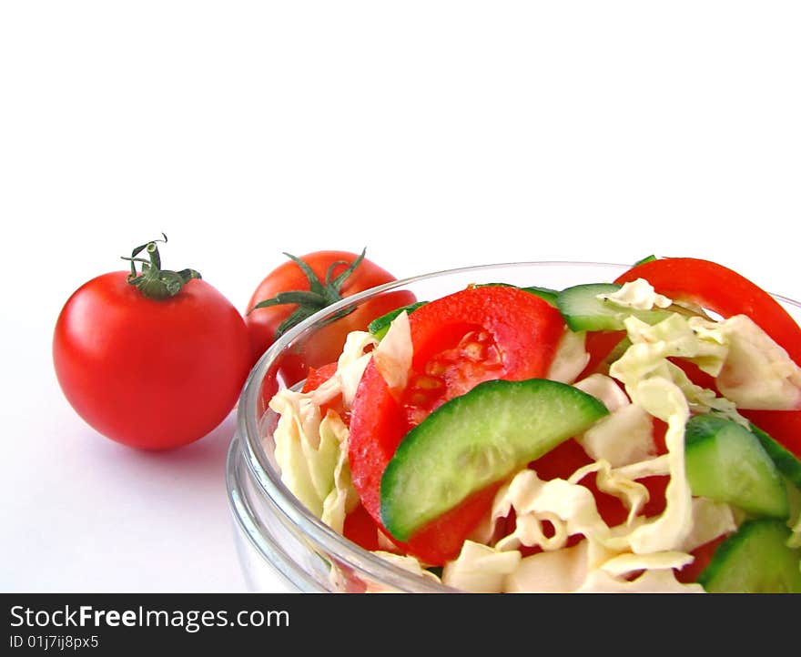 Fresh vegetable salad with tomato and cucumber isolated on white background