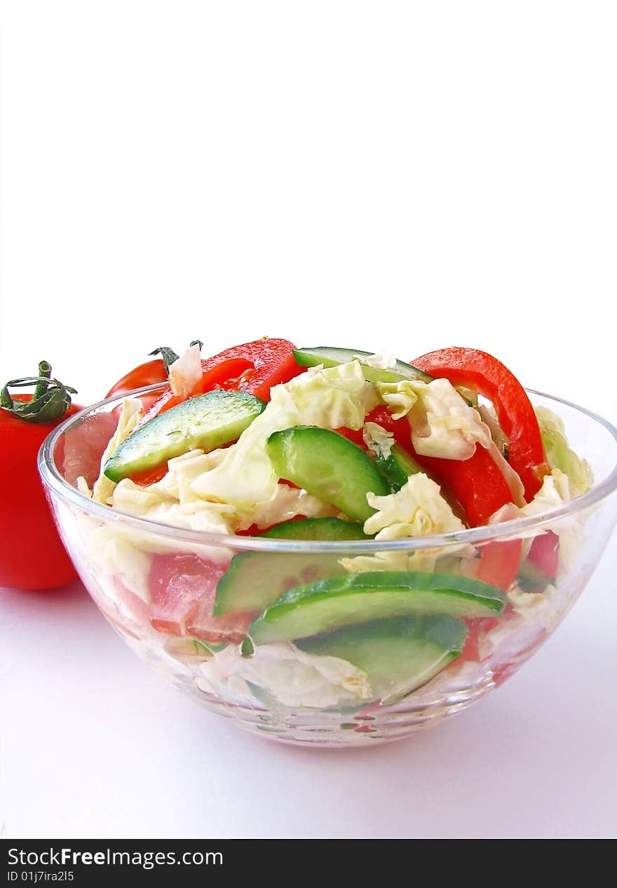 Fresh vegetable salad with tomato and cucumber isolated on white background