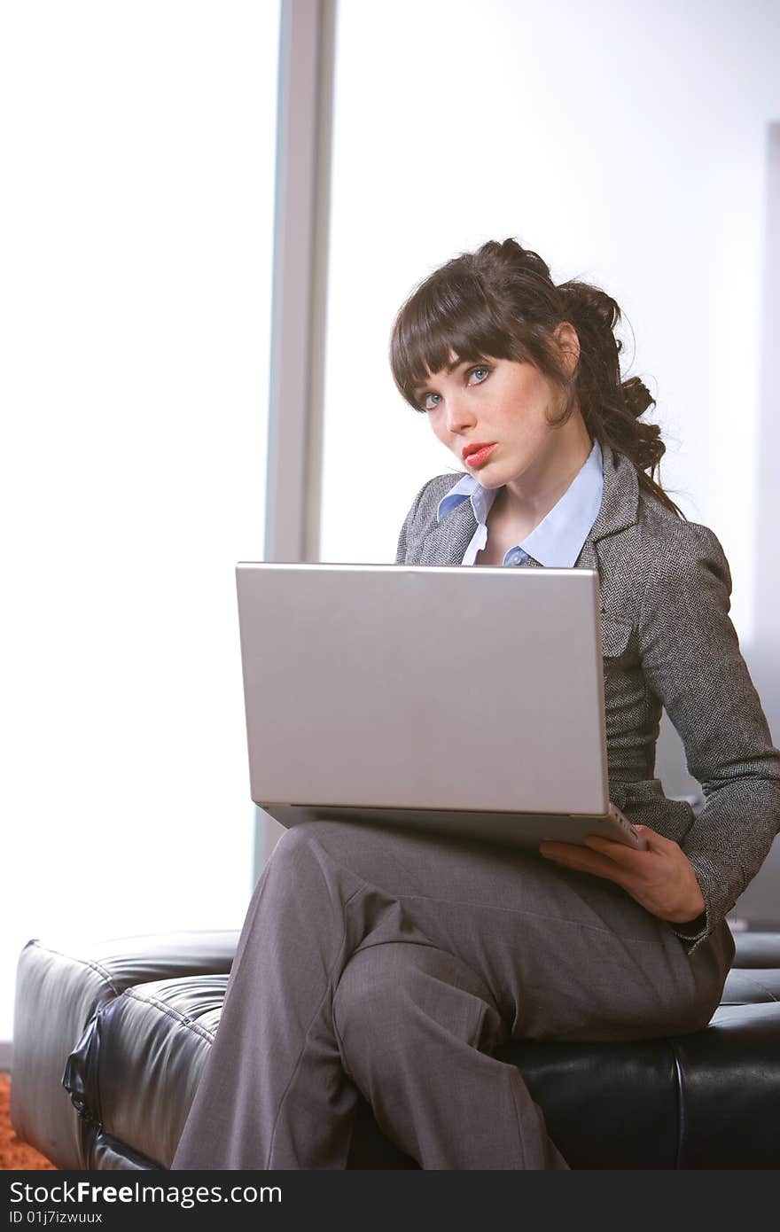 Business woman laptop in modern office. Business woman laptop in modern office