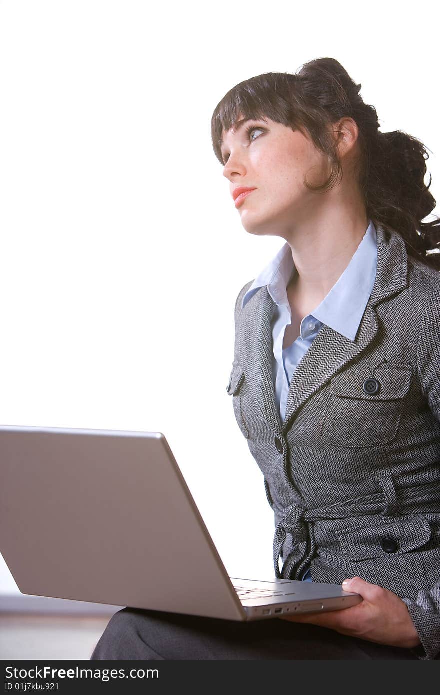 Business woman thinking in modern office with laptop. Business woman thinking in modern office with laptop