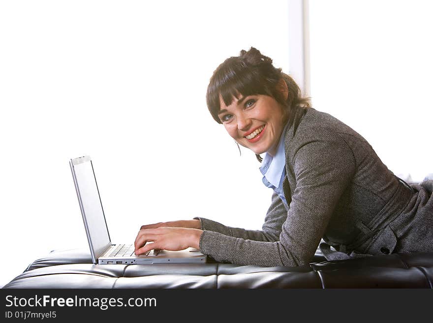 Business Woman on laptop in a modern loft office. Business Woman on laptop in a modern loft office