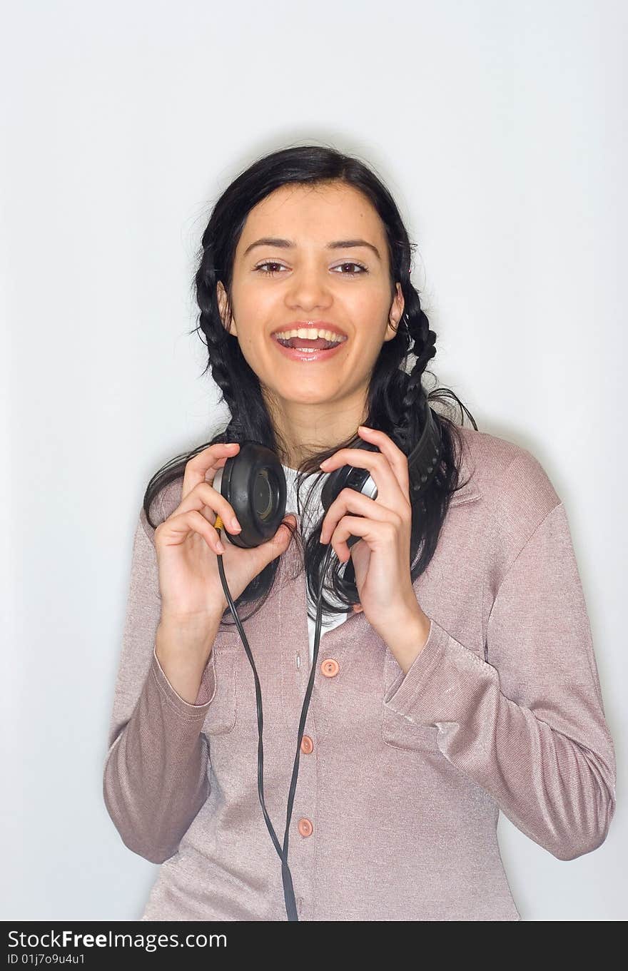 Young beautiful woman listening music