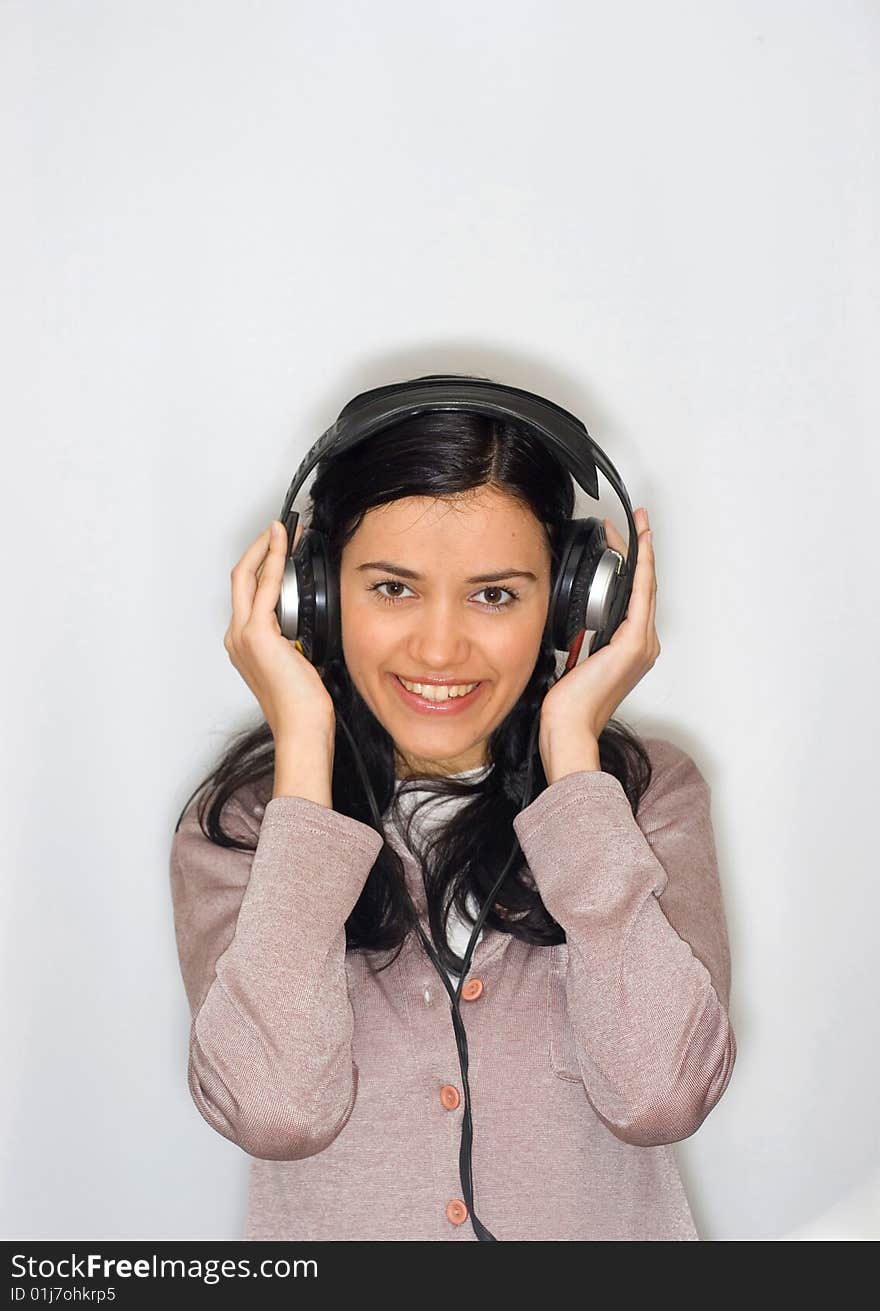 Young beautiful woman listening music