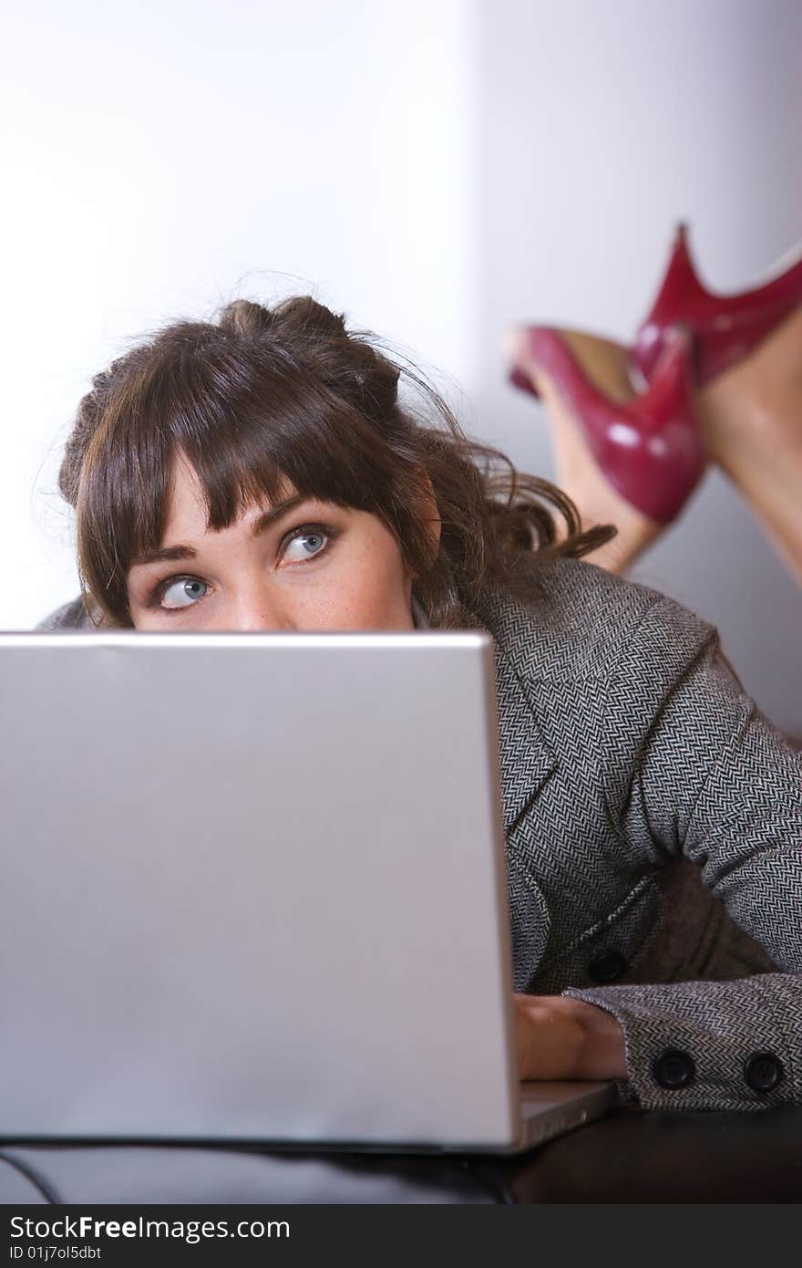 Business Woman on laptop in a modern loft office. Business Woman on laptop in a modern loft office