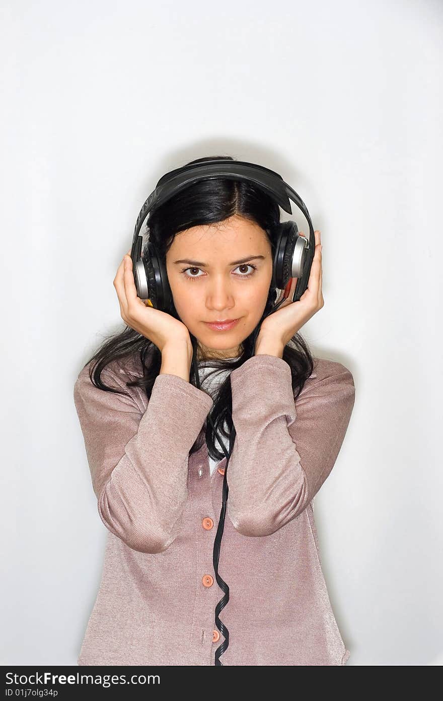 Young beautiful woman listening music