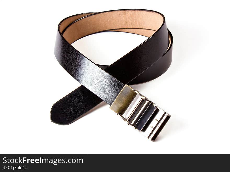 A black  leather belt isolated on white background. A black  leather belt isolated on white background