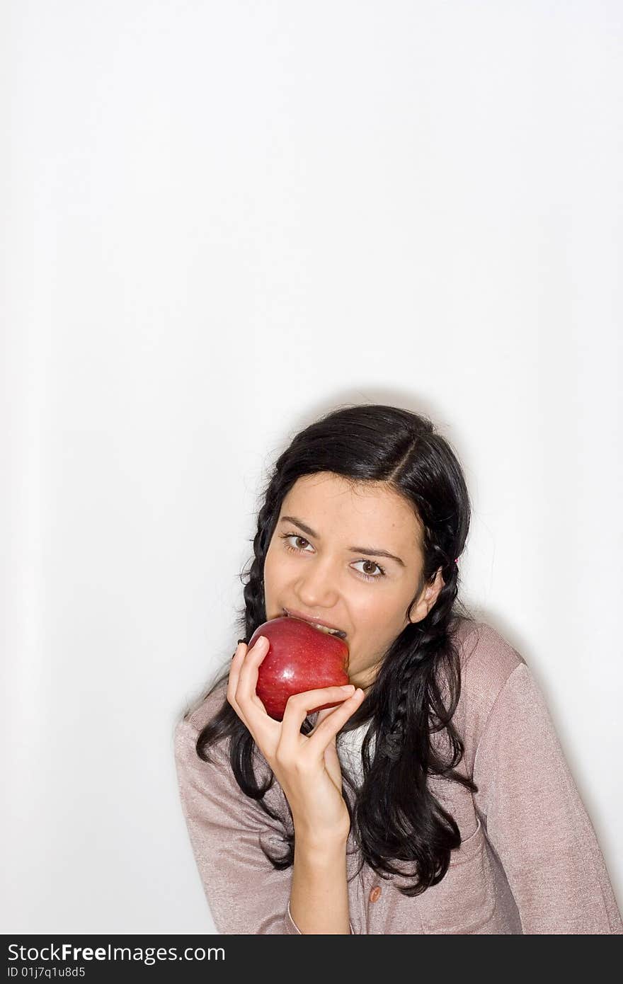 Young woman holding apple