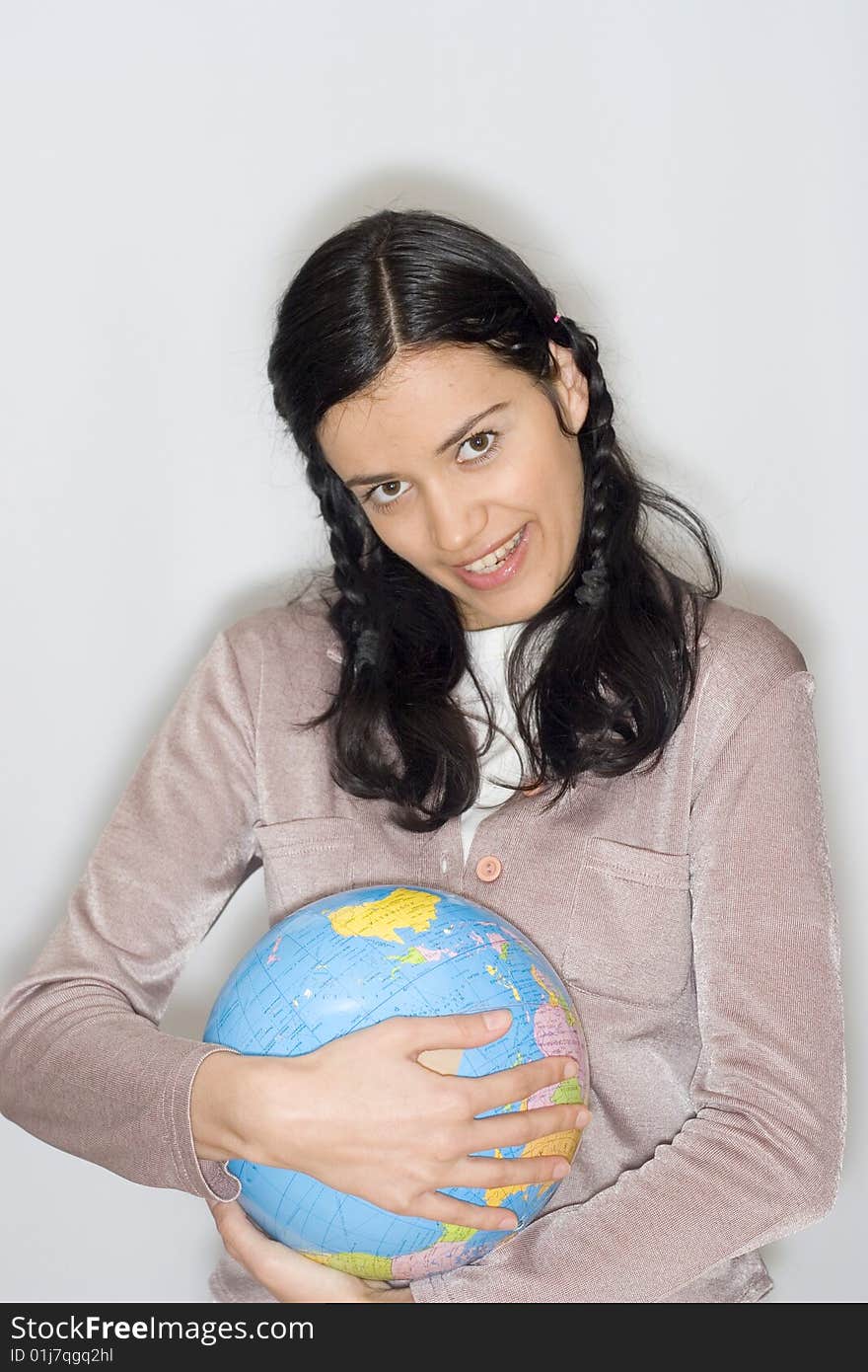 Young woman holding globe in her hands. Young woman holding globe in her hands