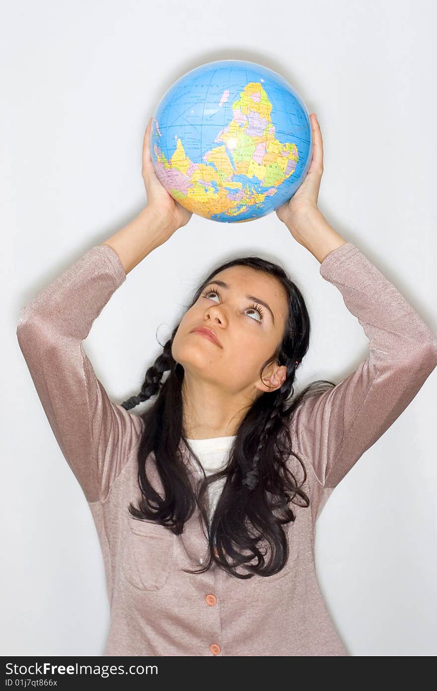 Young woman holding globe in her hands. Young woman holding globe in her hands