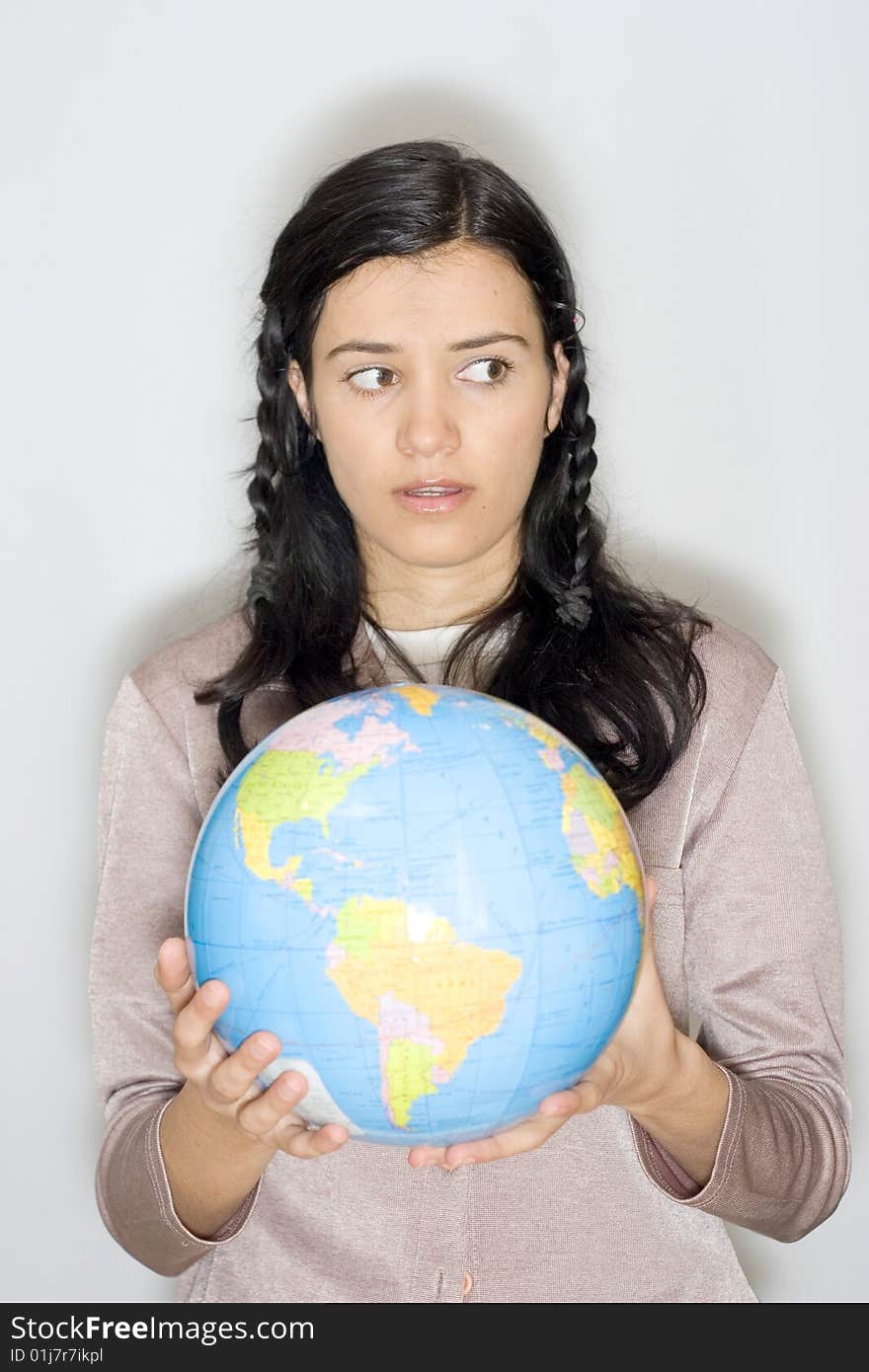 Young woman holding globe in her hands. Young woman holding globe in her hands