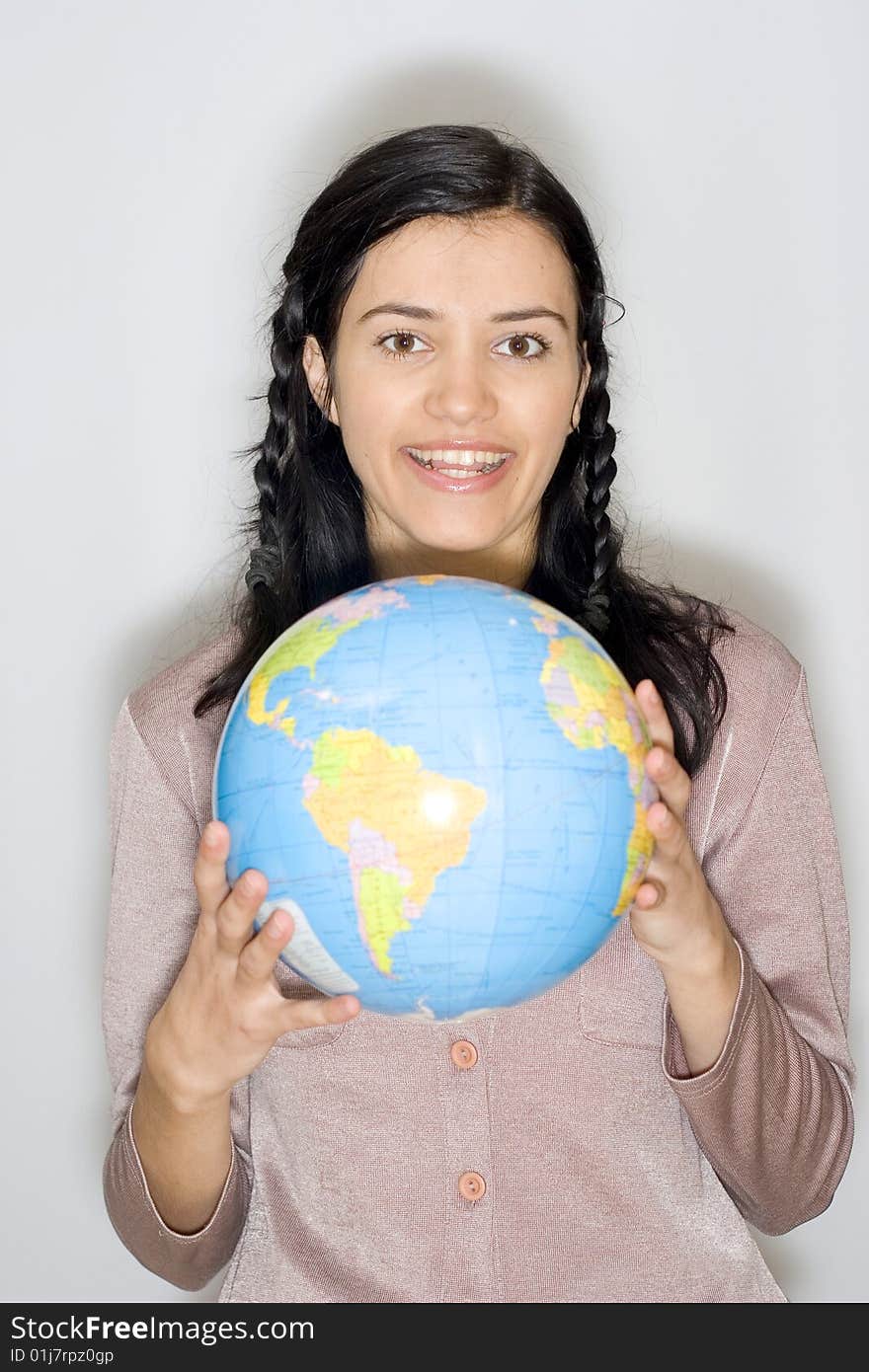 Young woman holding globe in her hands. Young woman holding globe in her hands