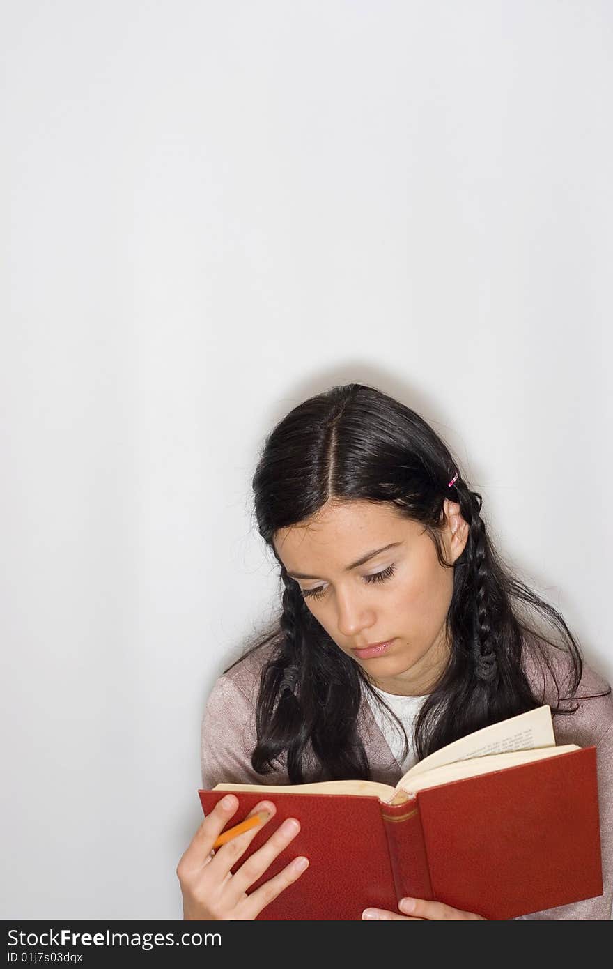 Young woman reading book