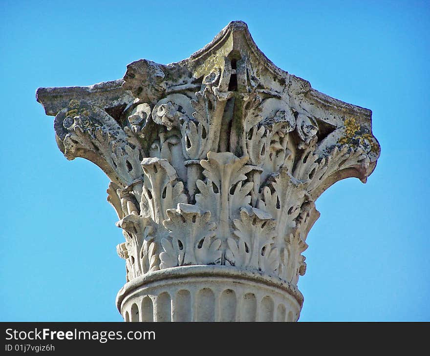 Corinthian column from Pompeii Italy isolated against a blue sky. Corinthian column from Pompeii Italy isolated against a blue sky.