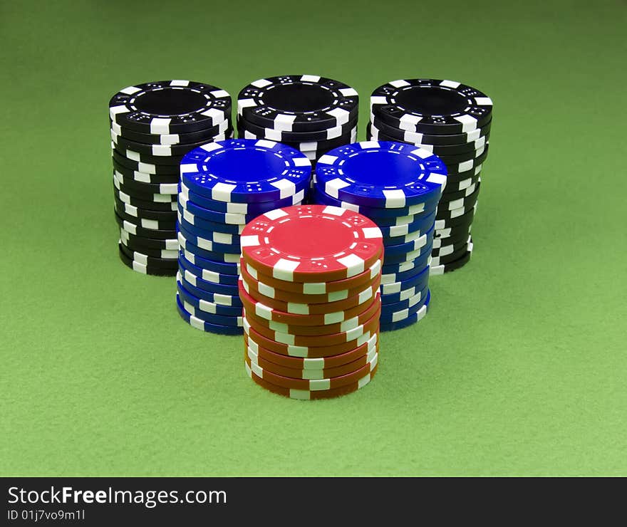 Casino chips over green poker table