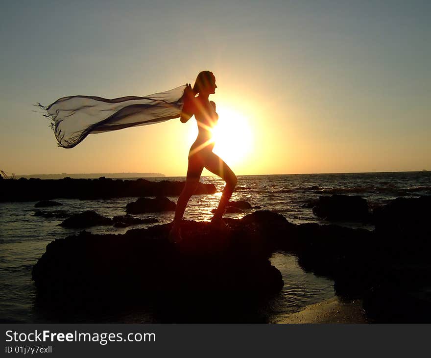 Silhouette of the young harmonous woman against horizon. Silhouette of the young harmonous woman against horizon