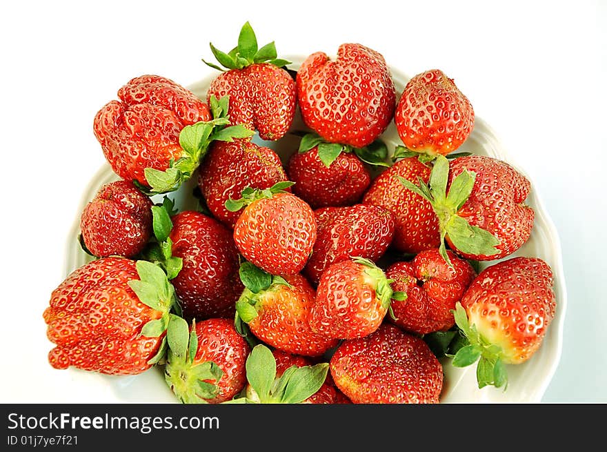 Plate of  strawberry on the white table. Plate of  strawberry on the white table.