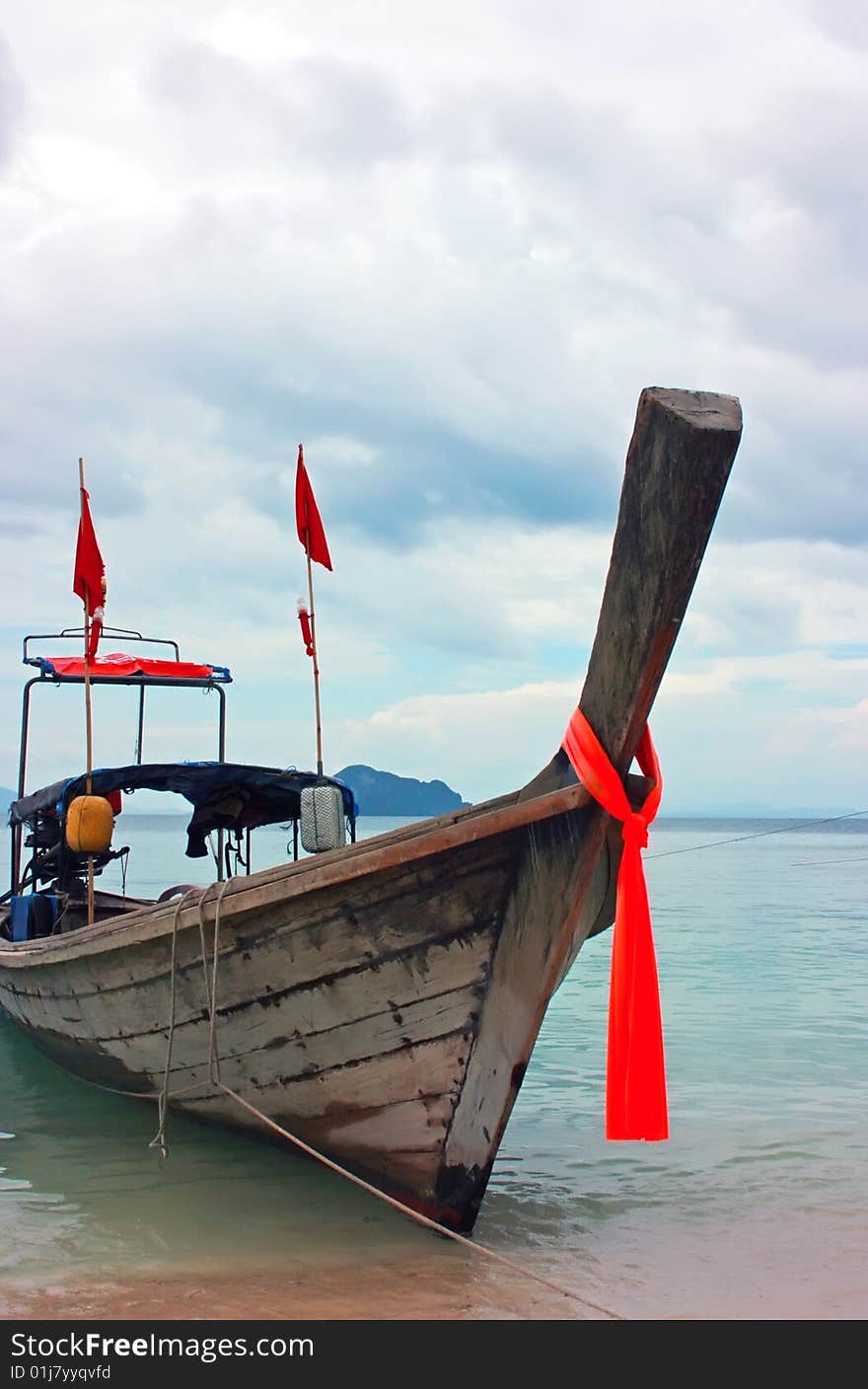 Thailand fish boat anchored to the beach