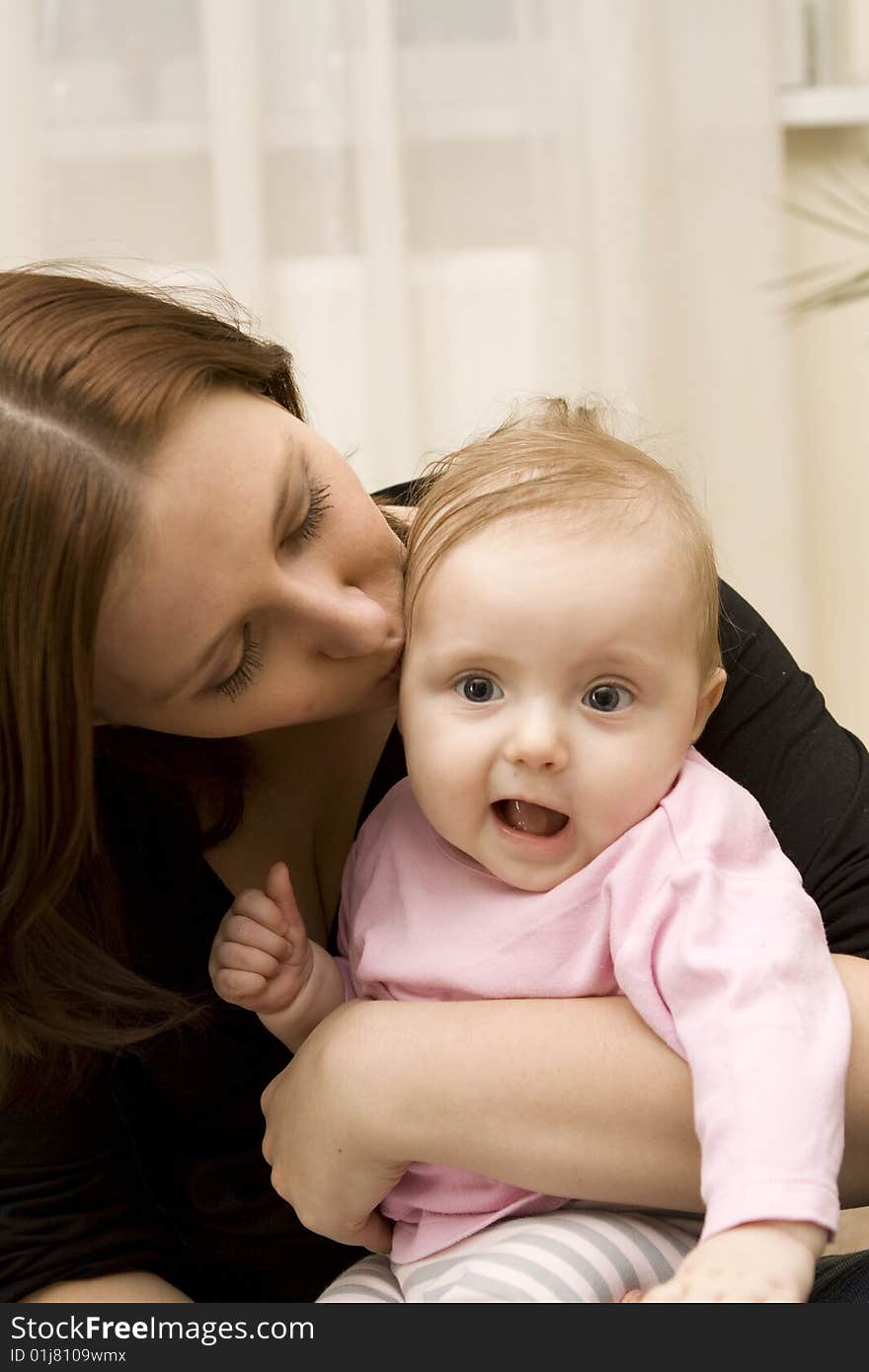 Mother And Baby Playing In Home