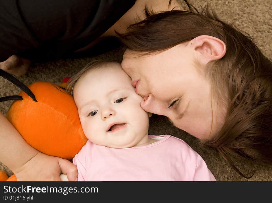 Mother and baby playing in home