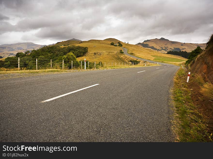 A country road twists through farmland