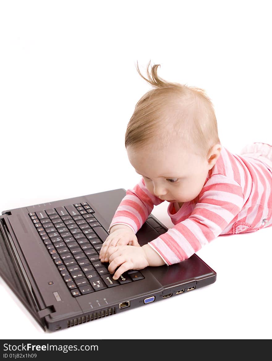 Little baby with laptop on white