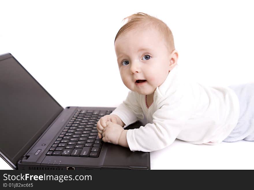 Little baby with laptop on white