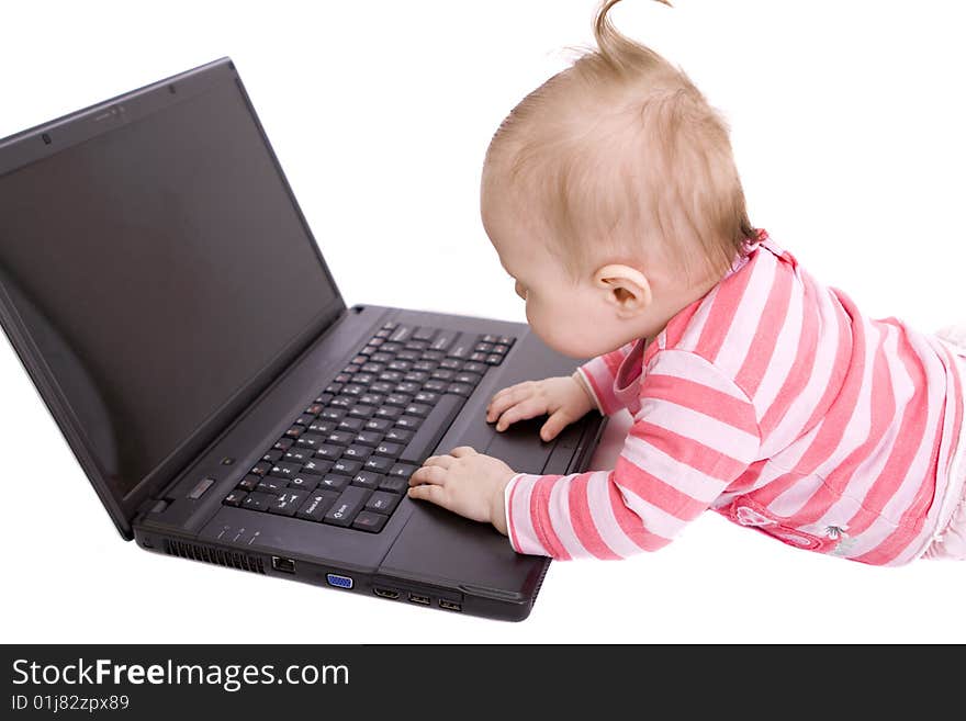 Little baby with laptop on white