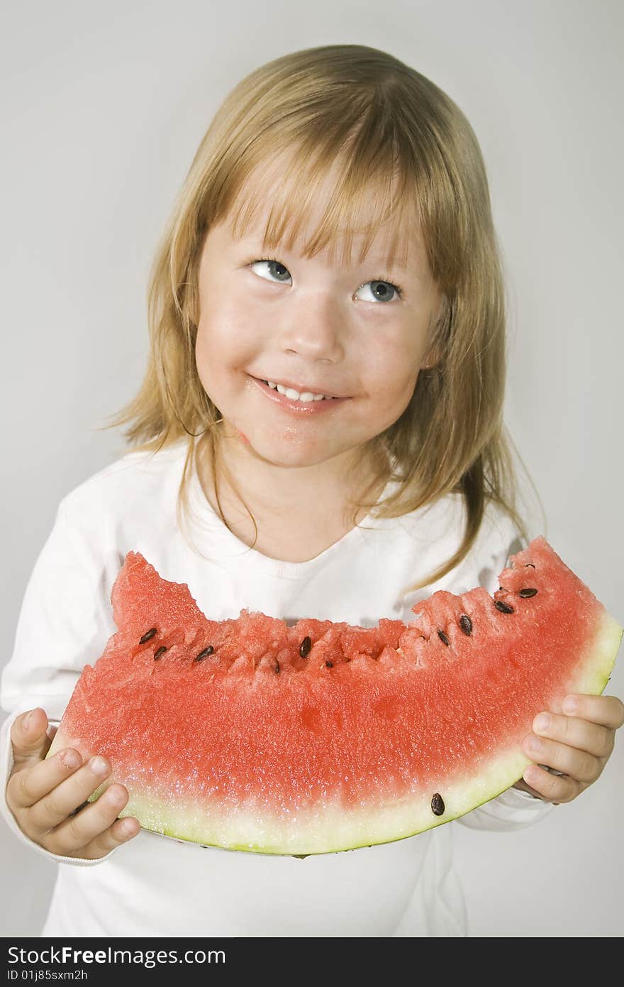 Picture of young girl and a slice of watermelon. Picture of young girl and a slice of watermelon