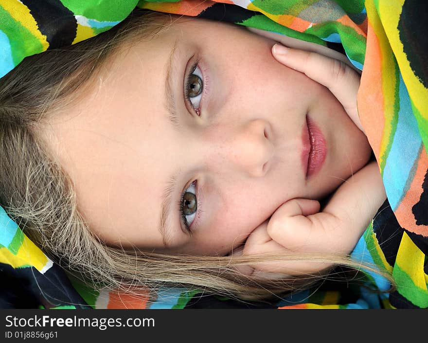 Pensive girl with exotic scarf