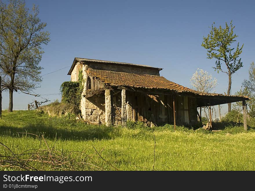 Old rural cabin during spring on a meadow. Old rural cabin during spring on a meadow