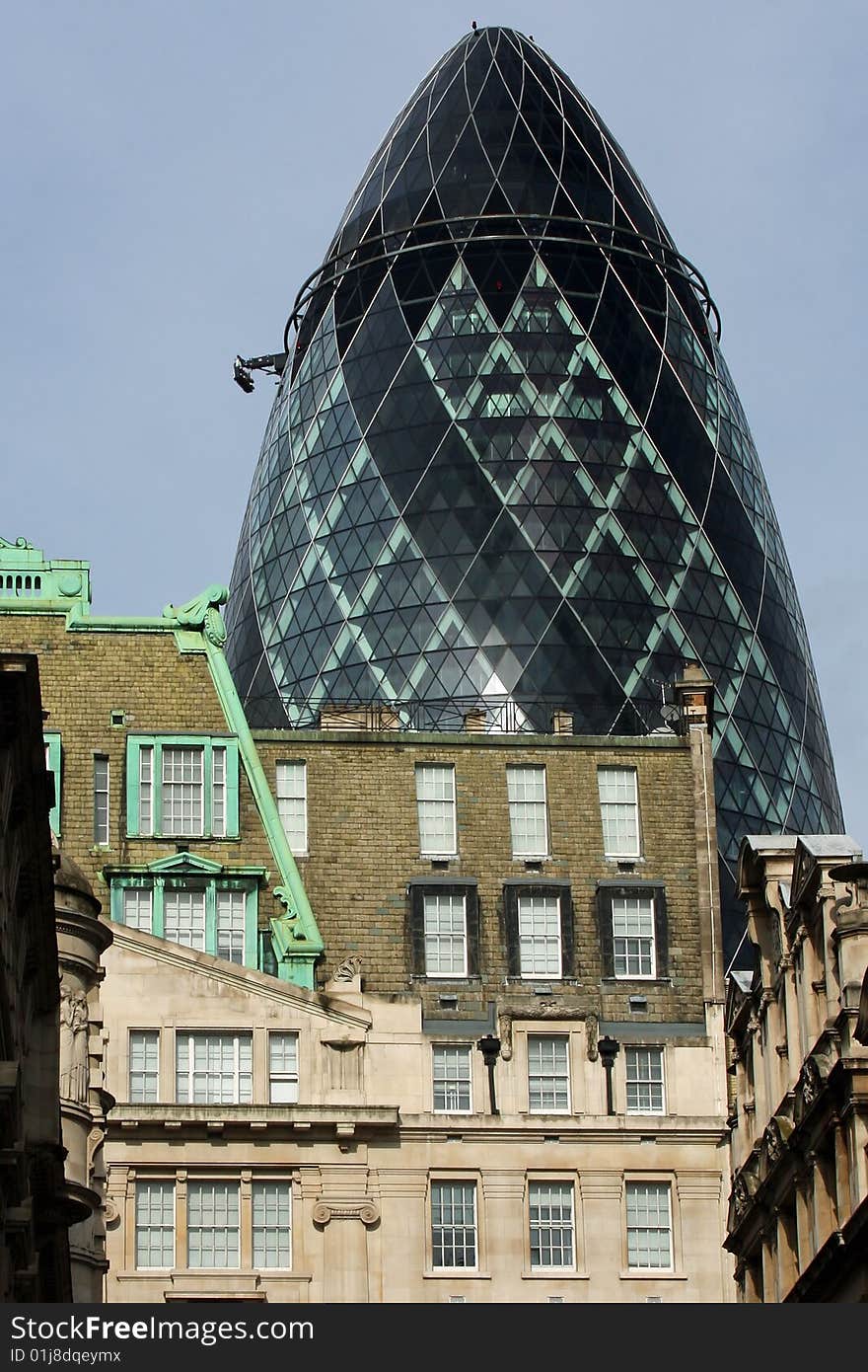 The Gherkin building amongst older buildings. ST Mary Axe